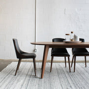 Table and chairs with the Eko Rug