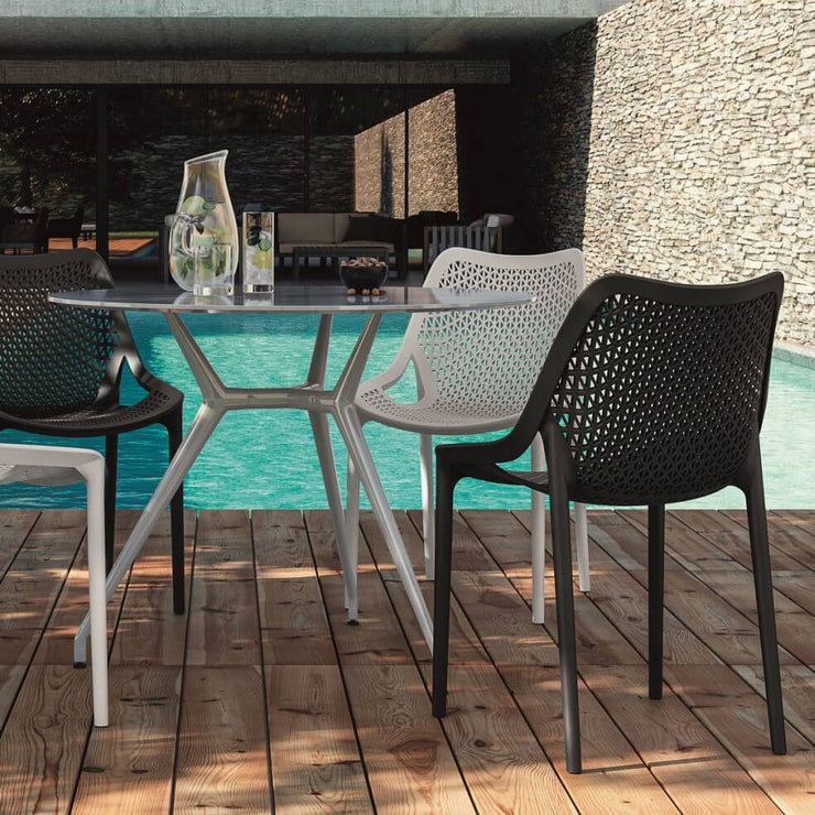 Bilros Outdoor Chair on a deck by a pool